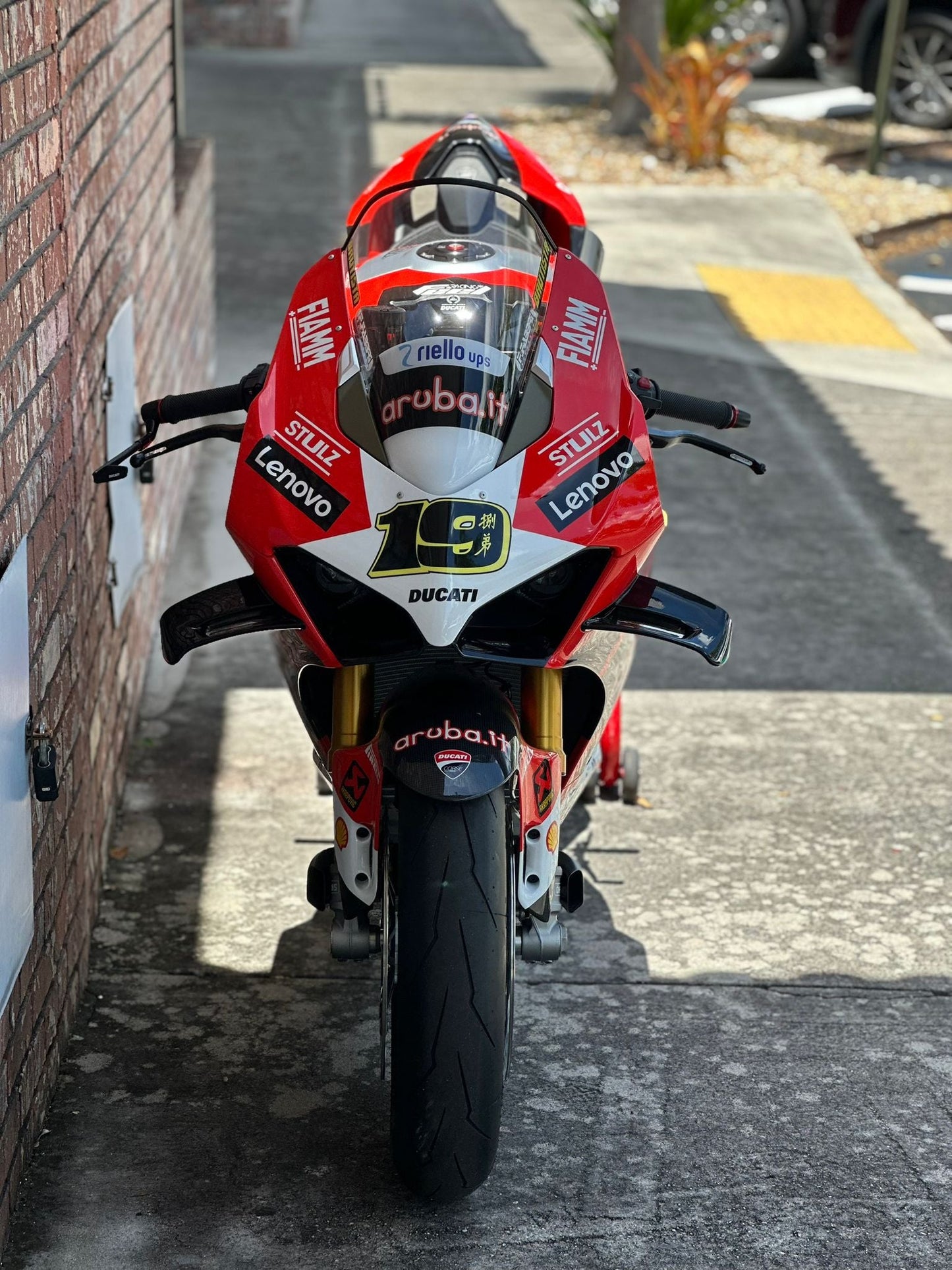 Yamaha R6 with aftermarket exhaust in Florida garage