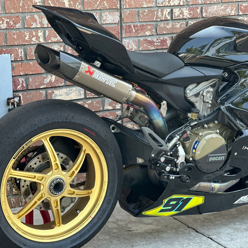 Group of motorcycles lined up at Broward County racetrack
