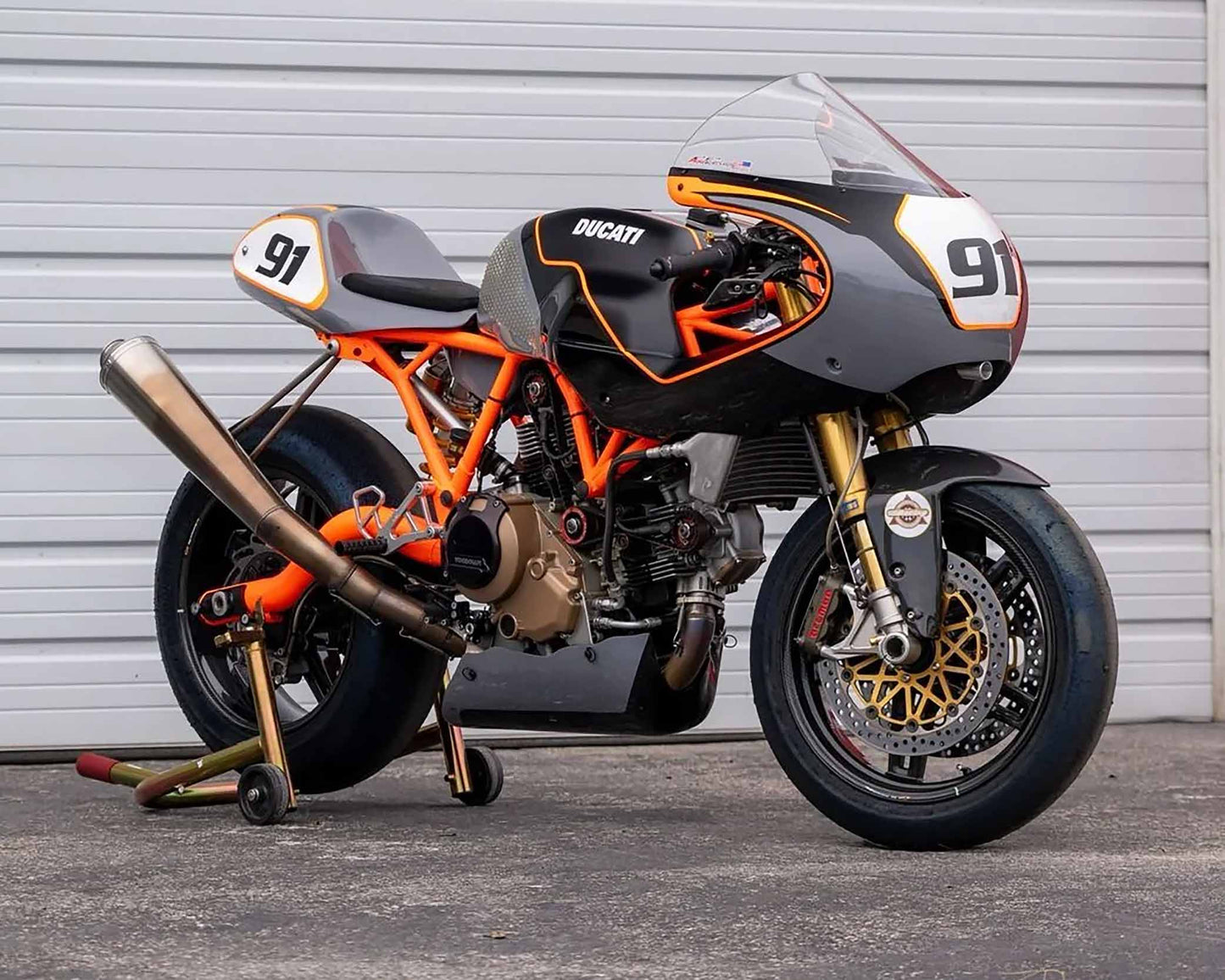 Rider in full racing gear preparing for a track day in South Florida
