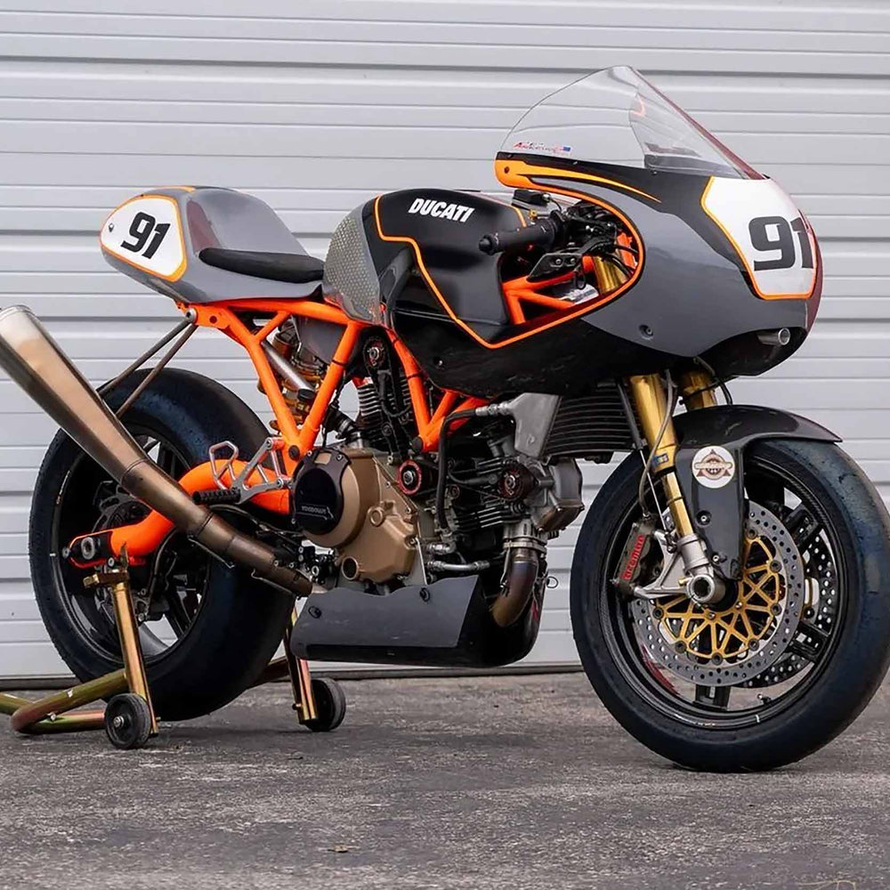A Yamaha R6 used race bike with slicks and race fairings on a stand at Top Pro Motorsports in South Florida.