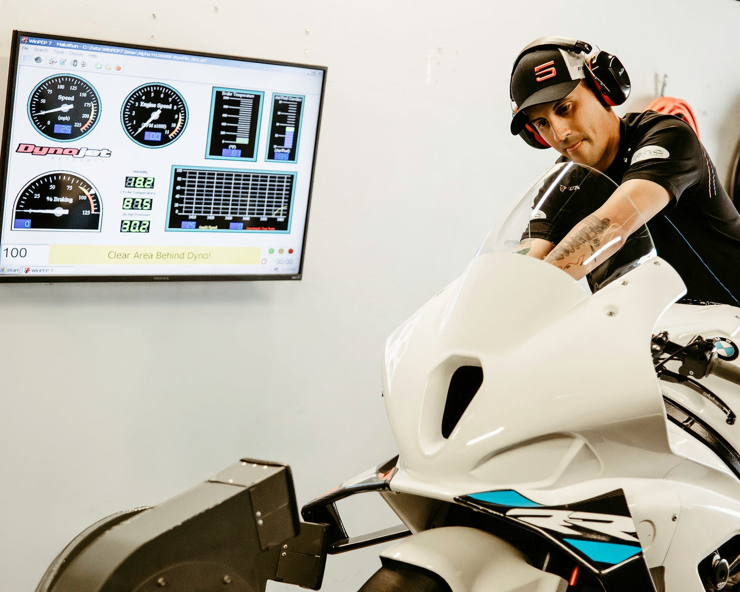Motorcycle on a dynamometer being tuned at Top Pro Motorsports in Coral Springs for optimal performance