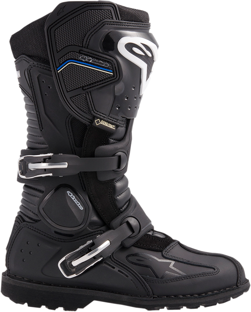 Close-up of track-grade gloves and racing boots